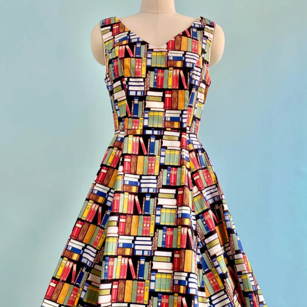 Book Print V-Neck Dress by Eva Rose